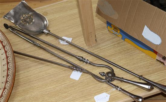 A set of three polished steel fire irons